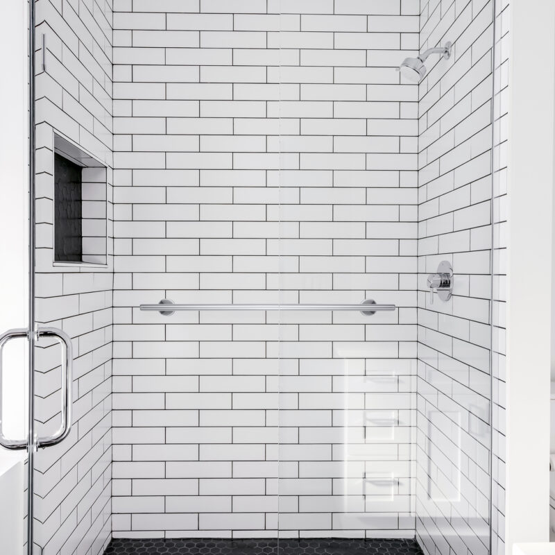 Modern All White Bathroom with White Subway Tile in Shower and B