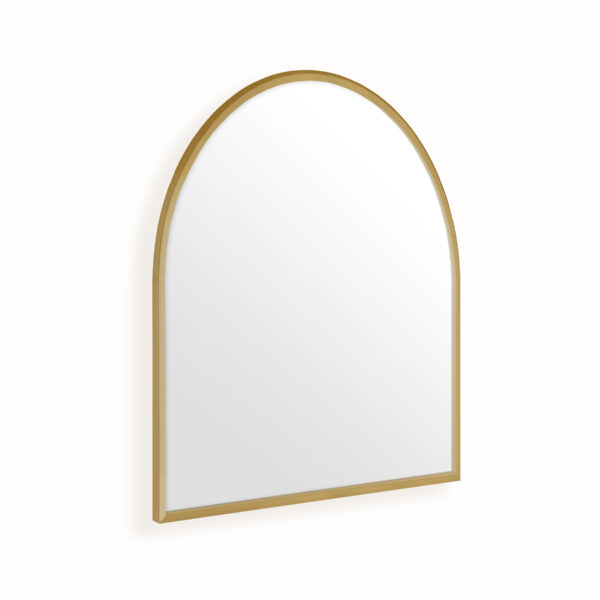 Brushed bronze mirror with arch shape on white wall